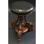 A Victorian mahogany piano stool, circular top, the base with turned columns, scroll leafy legs,
