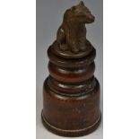 A 19th century Black Forest bear snuff bottle, the bear seated on turned pedestal, 11.5cm high, c.