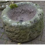 A circular Derbyshire gritstone hollowed out planter. 32cm high x 52cm diameter.