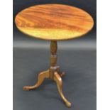 A George III mahogany circular occasional table, turned column, tripod legs, pad feet,