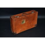 Vintage Luggage - a tan leather suitcase, paper label for The Royal Victoria Hotel, Pisa, 66cm wide,