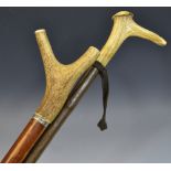 A holly walking stick, the horn handle with whistle, 100cm long; another,