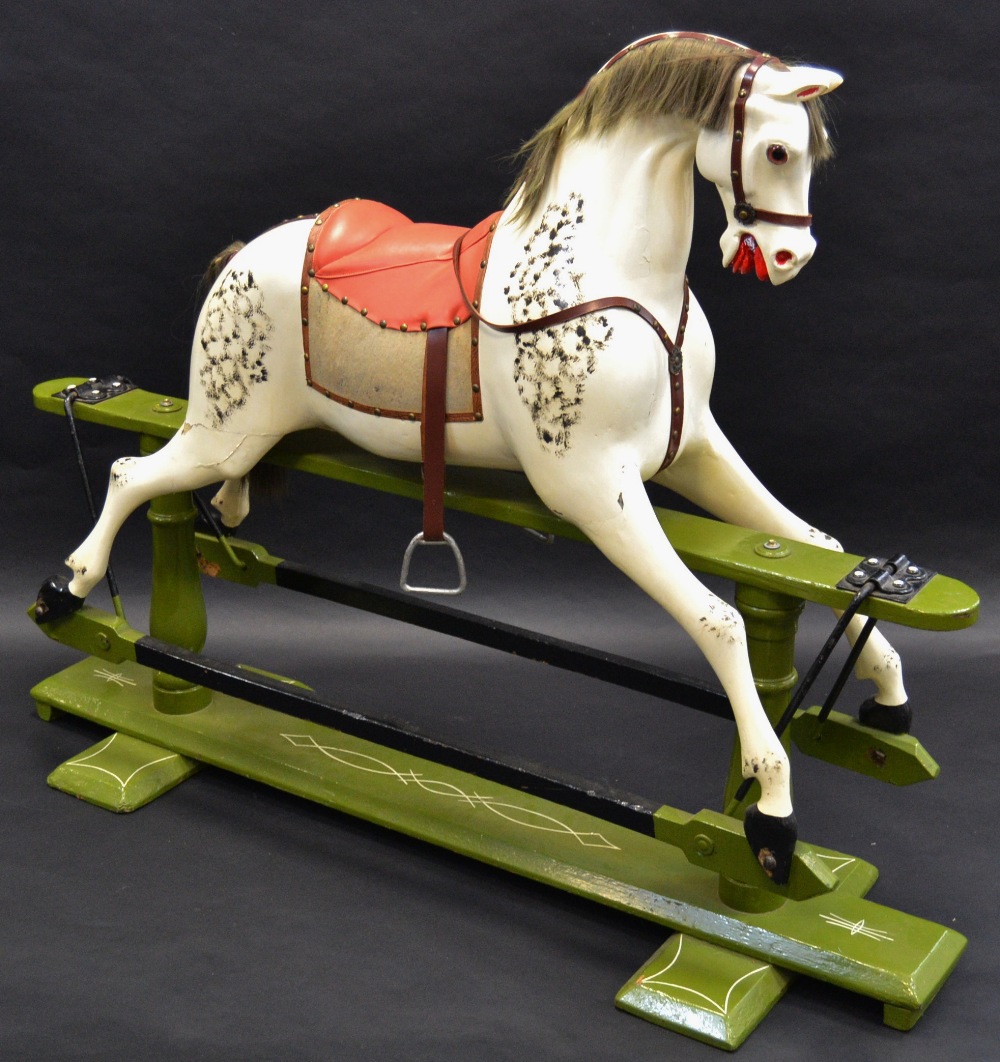 A good Victorian wooden rocking horse, in dapple grey, green sledge base,