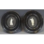 A Wedgwood Black Jasper oval plaques, sprigged in white with classical figures, 10cm x 8cm,