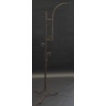 An 18th century style wrought iron lantern stand, twisted stand, tripod legs, 161cm high.