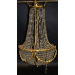 A 19th century design French gilt-metal and cut glass bag chandelier, strung with graduating drops,