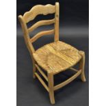 A child's West Country elm ladder back chair,