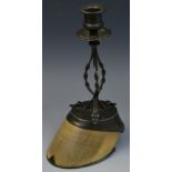 An early 20th century horse hoof candlestick, campana sconce, shaped circular drip-pan,