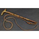 An early 20th century horn handled hunting whip, silver collar,