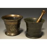 A 17th century style bronze mortar, cast with a crown over a rosette, associated pestle, 11.