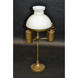 A oil lamp, with white glass shade, the column with two burners,