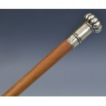 A 19th century silver coloured metal mounted gentleman's walking cane, fluted domed pommel,