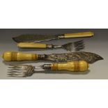 A set of Victorian fish servers, pierced and engraved with bird and foliage, turned ivory handles,