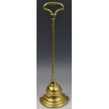 A 19th century brass door stop, with tall wrythen handle, stepped demi-bell base,