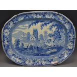 A Staffordshire British Scenery meat plate, pinted with figures in conversation before a church,