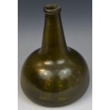 An 18th century green glass onion bottle, trailed rim, kick-up base with pontil scar,