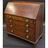 A George III oak bureau, with fall front, the interior with drawers and pigeon holes,