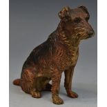 An Austrian cold painted bronze model, of a terrier, seated, 9cm high,