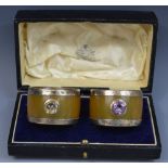 A pair of Scottish horn and silver mounted napkin rings, set with semi-precious stones,