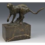 French School, a brown patinated cold cast sculpture, of a lioness, running, veined marble base,