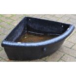 A late 19th/early 20th century cast iron corner horse trough/feeder