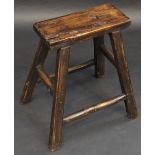 A rustic stool, square top,