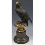 After Archibald Thorburn, a brown patinated sculpture, of an eagle, 31cm high,