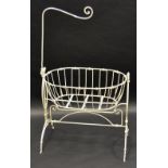 A Victorian wrought iron cradle, painted white, c.