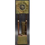 An early 20th century 'Antiquarian' water clock, 21cm square brass dial with Roman numerals,