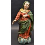 A North European polychrome painted carving, of a female saint,