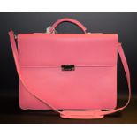 A Claudio Ferrici pink leather brief case, lime green liner, used once,