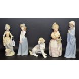A Nao figure of a seated Spaniel; a Nao figure of a lady washing; another, similar,