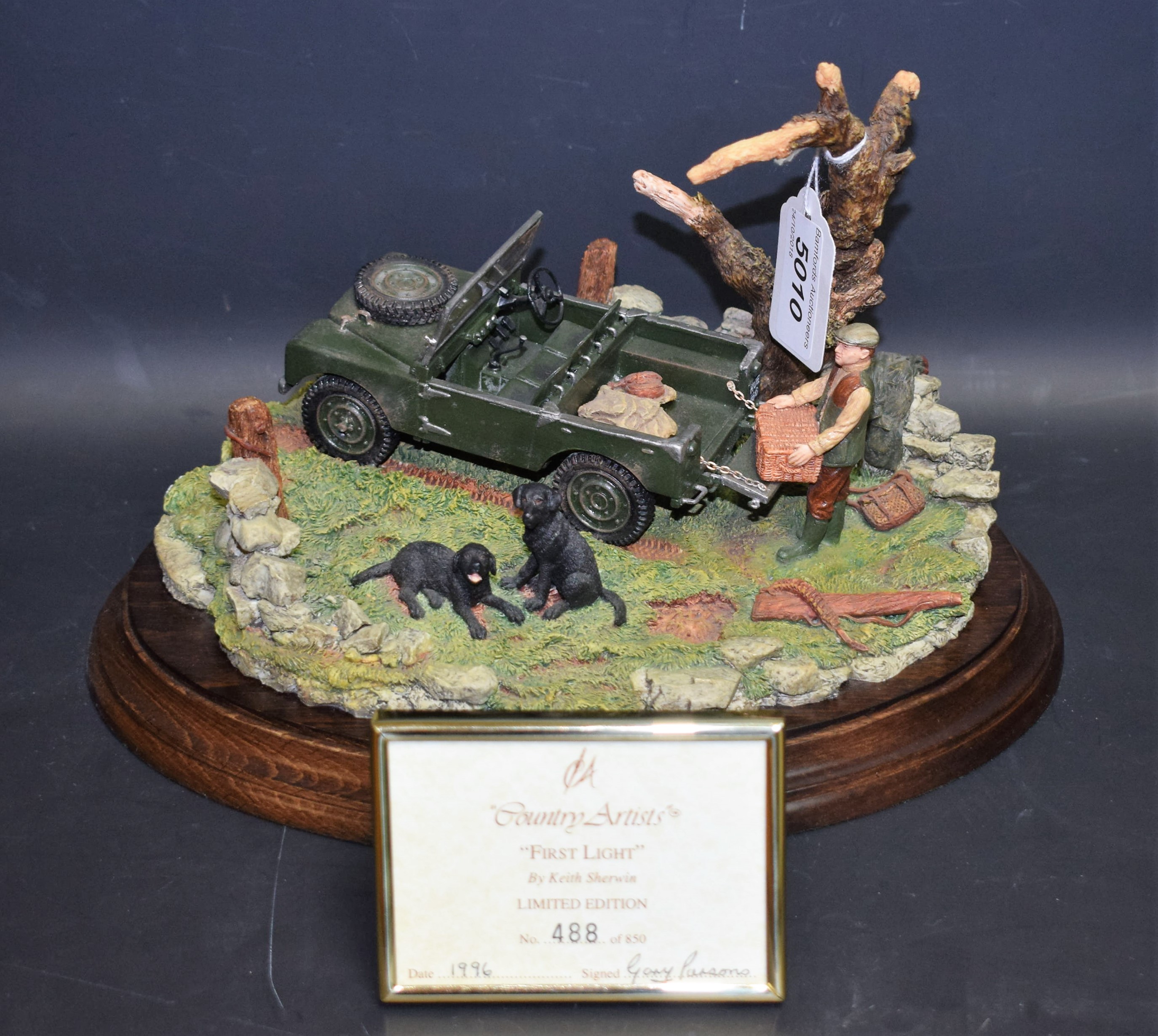 A Country Artists resin model, First Light, by K Sherwin, a farmer with two black Labrador dogs,