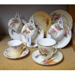 A set of four Royal Worcester cups and saucers, painted by George Hundley, with ferns and grasses,