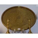 A large Persian style brass charger,