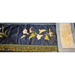 Textiles - a late Victorian silk over mantel panel with satin work embroidered lilies on black