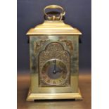 A heavy brass 'bracket' mantel clock,