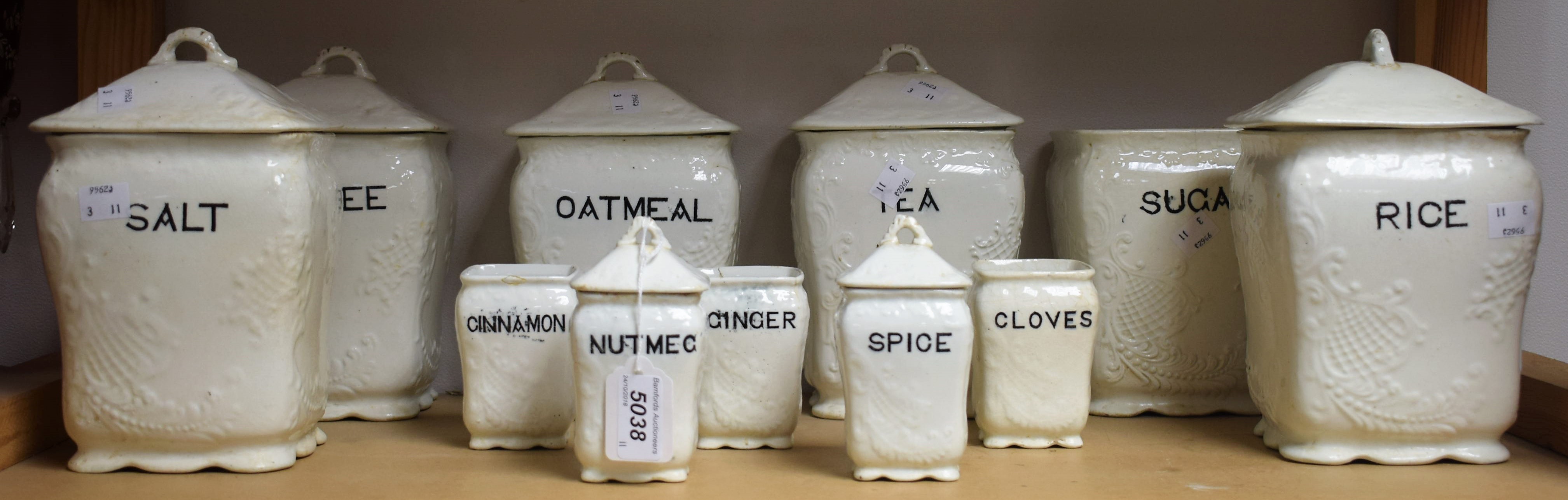 A Victorian Staffordshire part set of kitchen storage jars with transfer printed contents labels,