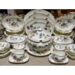 A Wedgwood Cuckoo pattern dinner service for eight, comprising dinner plates, salad plates,