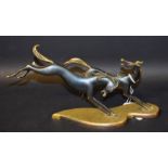A Portuguese Art Deco style dark patinated desk bronze, cast as a pair of stylised prancing horses,