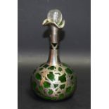 An Art Nouveau green glass silver mounted scent bottle,