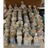 Ceramics - 19th century continental figures and figural spill vases including children, policeman,