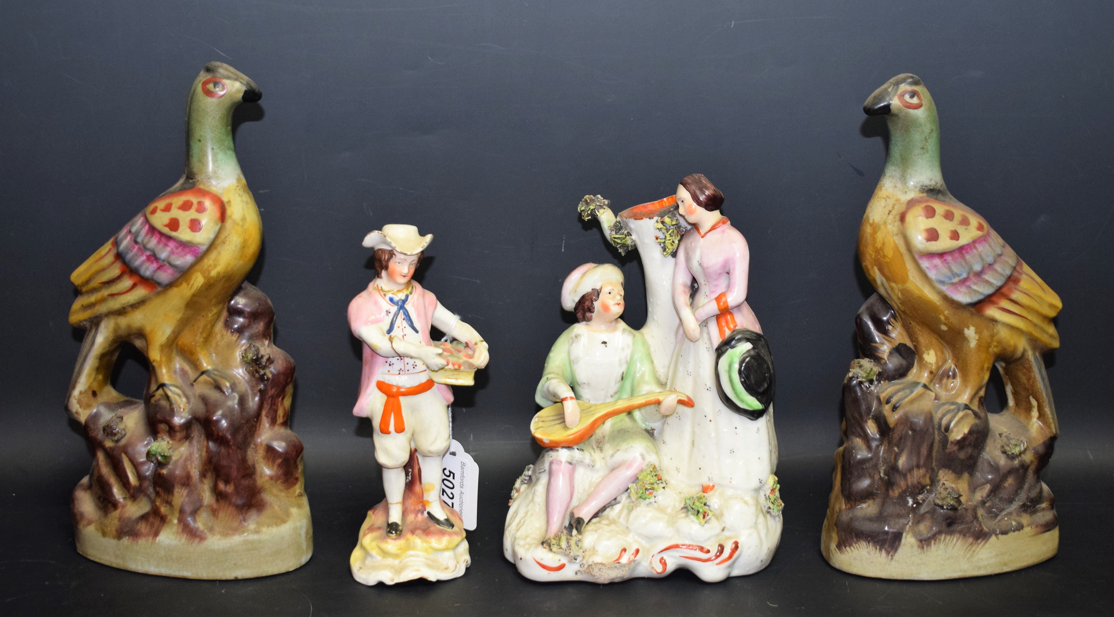 Ceramics - a mid 19th century Staffordshire flatback spill vase figure group of a lute player and