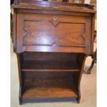 An Edwardian Arts and Crafts style oak bureau with bookshelves