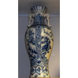 A large Japanese blue and white floor vase, decorated in blue with stylised flowers and scrolls,