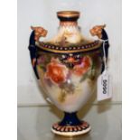 A Hadleys Worcester pedestal ovoid vase, decorated with roses, lion masks flying handles,