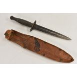 A Fairburn Sykes-type commando fighting knife, 16cm pointed fullered steel blade,