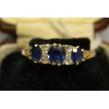 A diamond and sapphire ring,