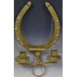 Equestrian Interest - a brass two-light wall sconce, as a horseshoe, the arms as a bit,