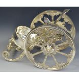 A contemporary novelty plated wine bottle holder/nef, as a cannon, large spoked wheels,